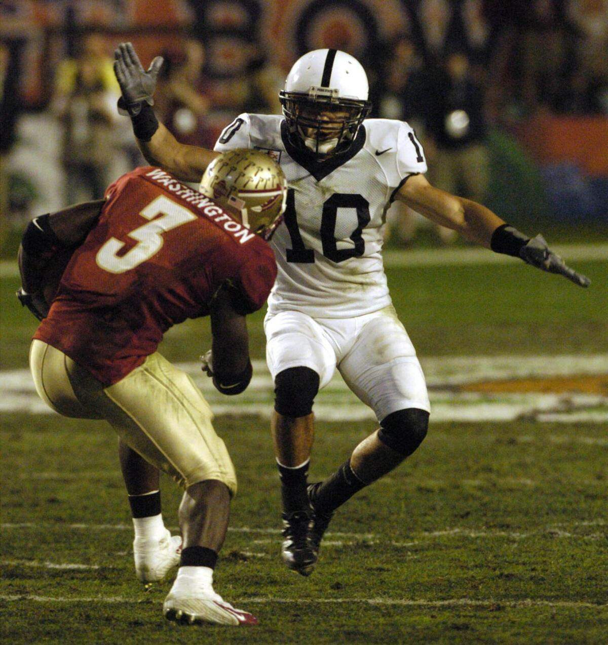 Penn State’s Calvin Lowry (10) prepares to stop Florida State’s Leon Washington (3) in the first quarter in the Orange Bowl on Tuesday, Jan 3, 2005.