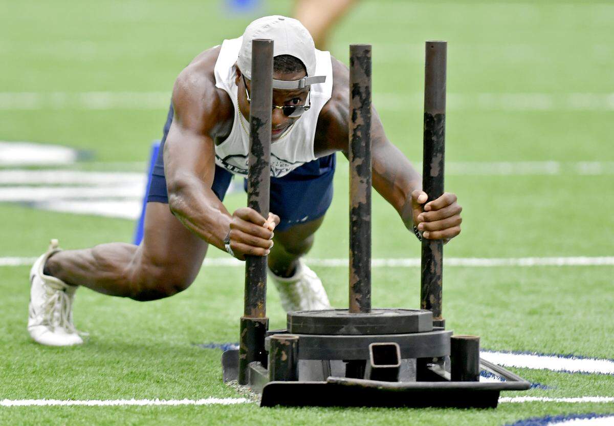 Penn State safety Garrett Taylor competes in the sled push during the annual Uplifting Athletes’ Lift for Life on Friday, July 12, 2019 at Holuba Hall.  