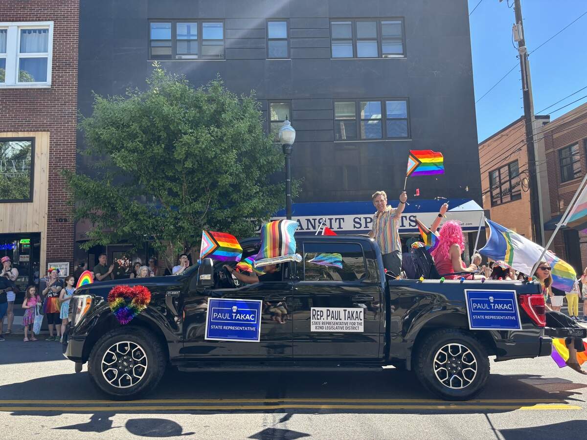 State Rep. Paul Takac waves to the crowd during the State College Pride parade on Saturday, June 13, 2026.
