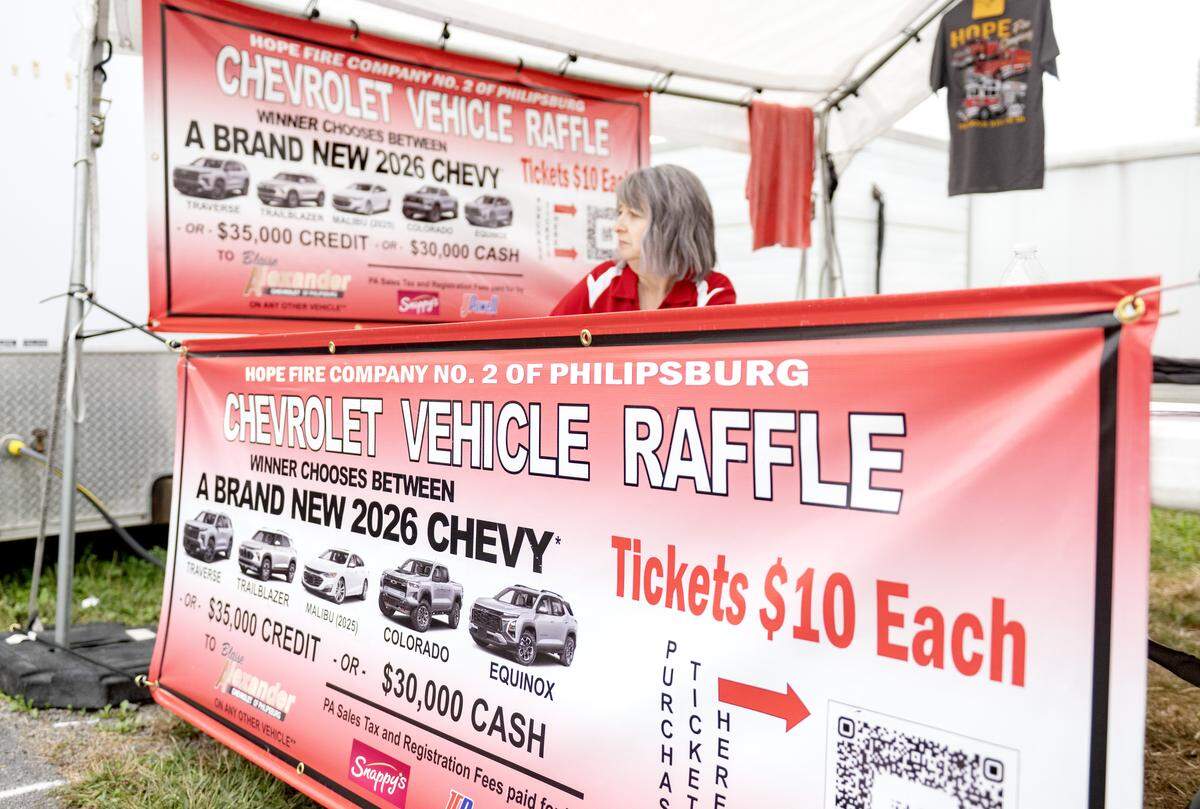 The Hope Fire Company has a stand to sell tickets for their vehicle raffle at the Centre County Grange Fair on Thursday, Aug. 21, 2025. 