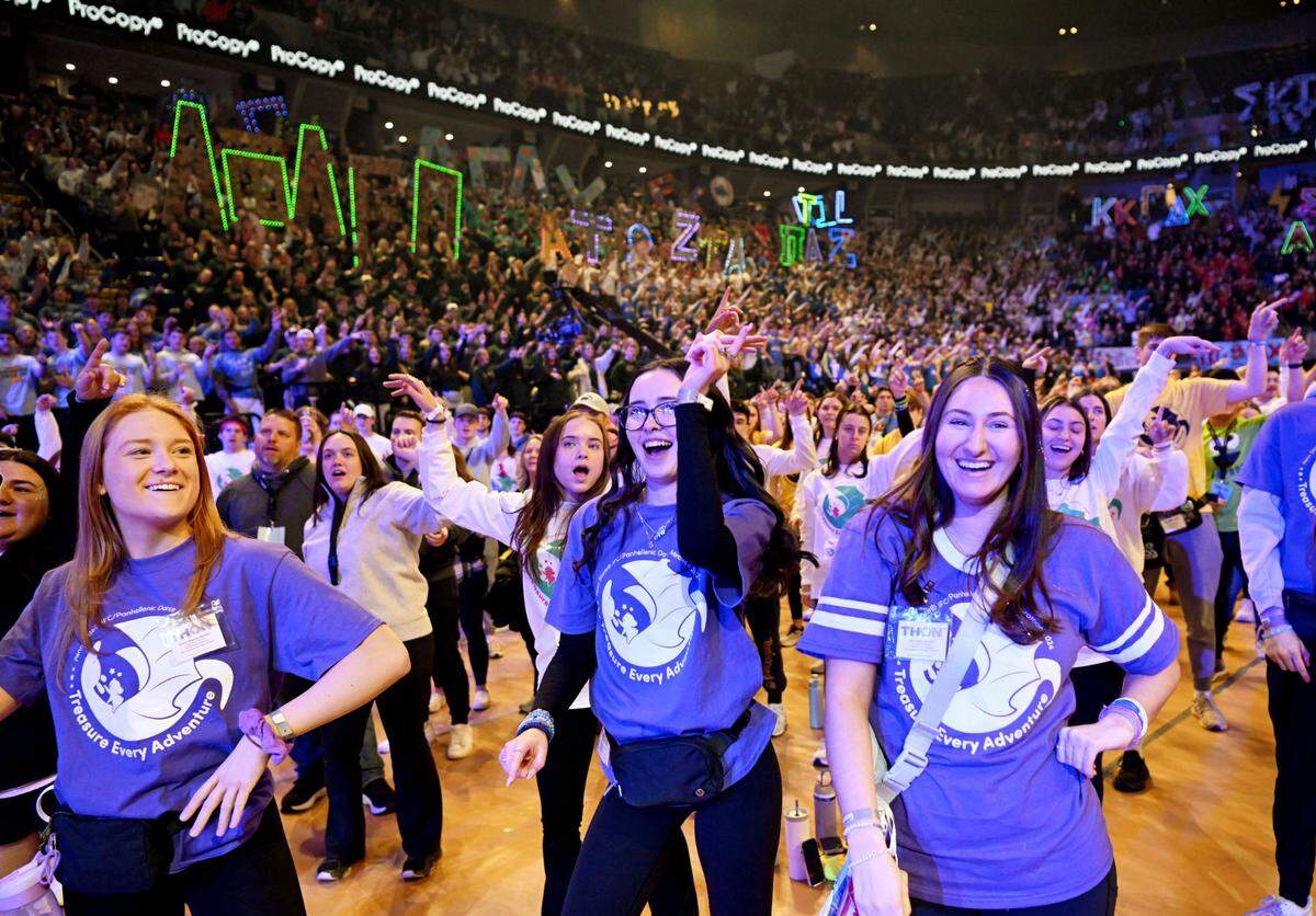 Committee members laugh as they sing along to the line dance during the Penn State IFC/Panhellenic Dance Marathon on Friday, Feb. 16, 2024 at the Bryce Jordan Center. The line dance is performed once an hour through the 46 hours.