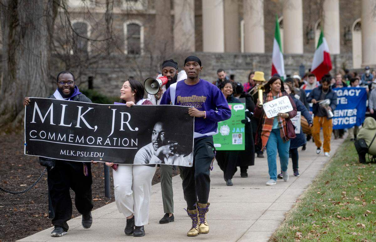 Students and community members joined together to march through the Penn State campus and downtown State College Wednesday for a “March for Peace.”