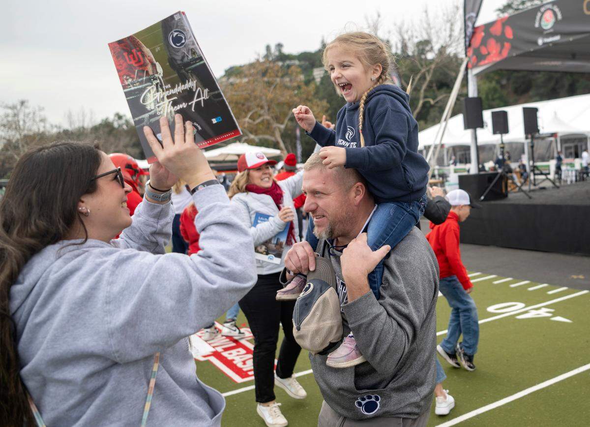 Hayslee Adams, 4, laughs as she dances with her family at a tailgate party before the Rose Bowl game on Monday, Jan. 2, 2023. The Adams family traveled from State College to cheer on the Nittany Lions.