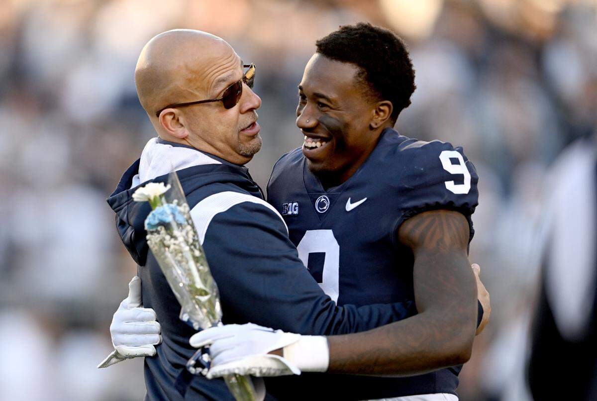 Penn State football coach James Franklin hugs senior Joey Porter Jr. before the game against Michigan State on Saturday, Nov. 26, 2022.