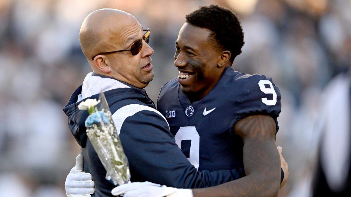 Penn State football coach James Franklin hugs senior Joey Porter Jr. before the game against Michigan State on Saturday, Nov. 26, 2022.