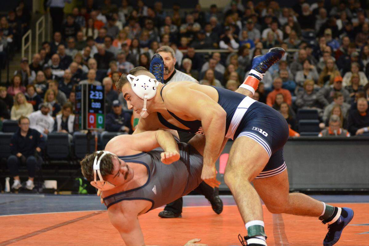 Penn State’s Anthony Cassar finishes off a double-leg takedown on Bucknell’s Brandon Stokes during their 285-pound match on Friday night. Cassar pinned Stokes in 32 seconds during the Nittany Lions’ 42-3 win.