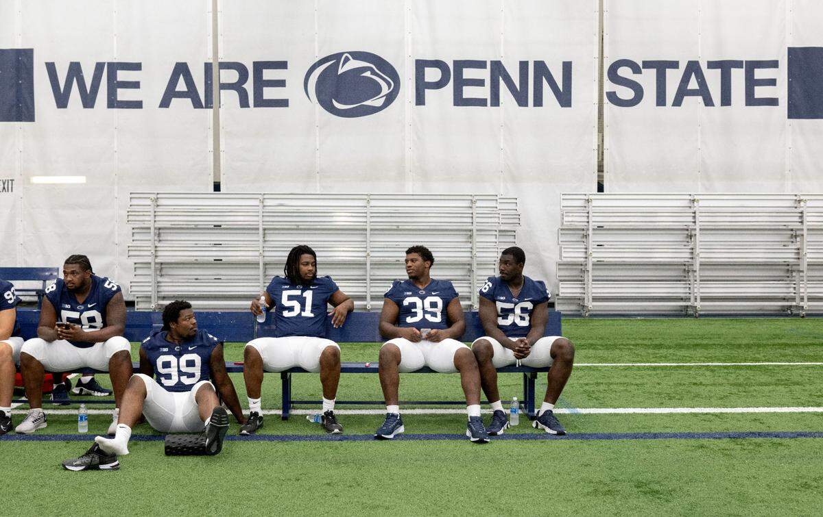 Defensive players Coziah Izzard, Hakeem Beamon, Ty Blanding and Joseph Mupoy chat during media day on Saturday, Aug. 3, 2024.