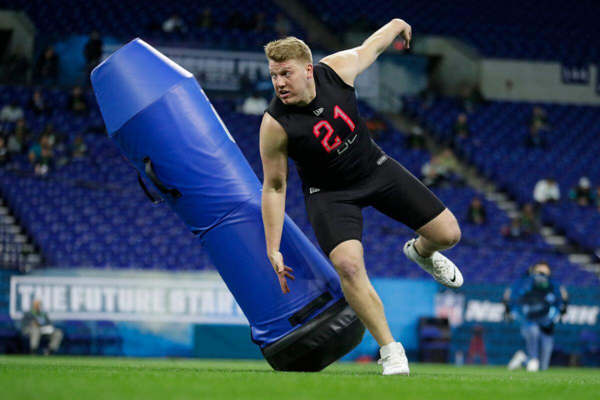 Penn State defensive lineman Rob Windsor runs a drill at the NFL football scouting combine in Indianapolis, Saturday, Feb. 29, 2020. (AP Photo/Michael Conroy)