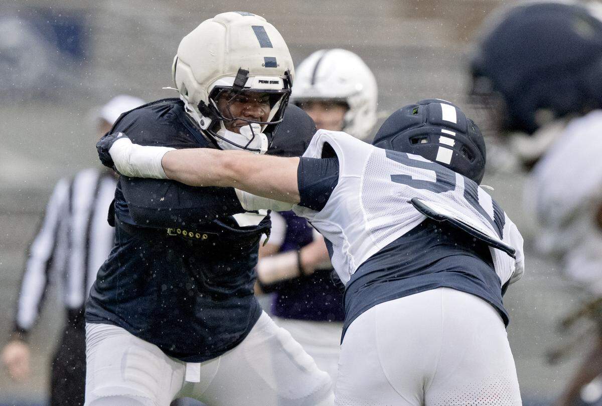 Penn State offensive lineman Malachi Goodman blocks Penn State defensive tackle Liam Andrews during the Blue-White Practice on Saturday, April 25, 2026.  
