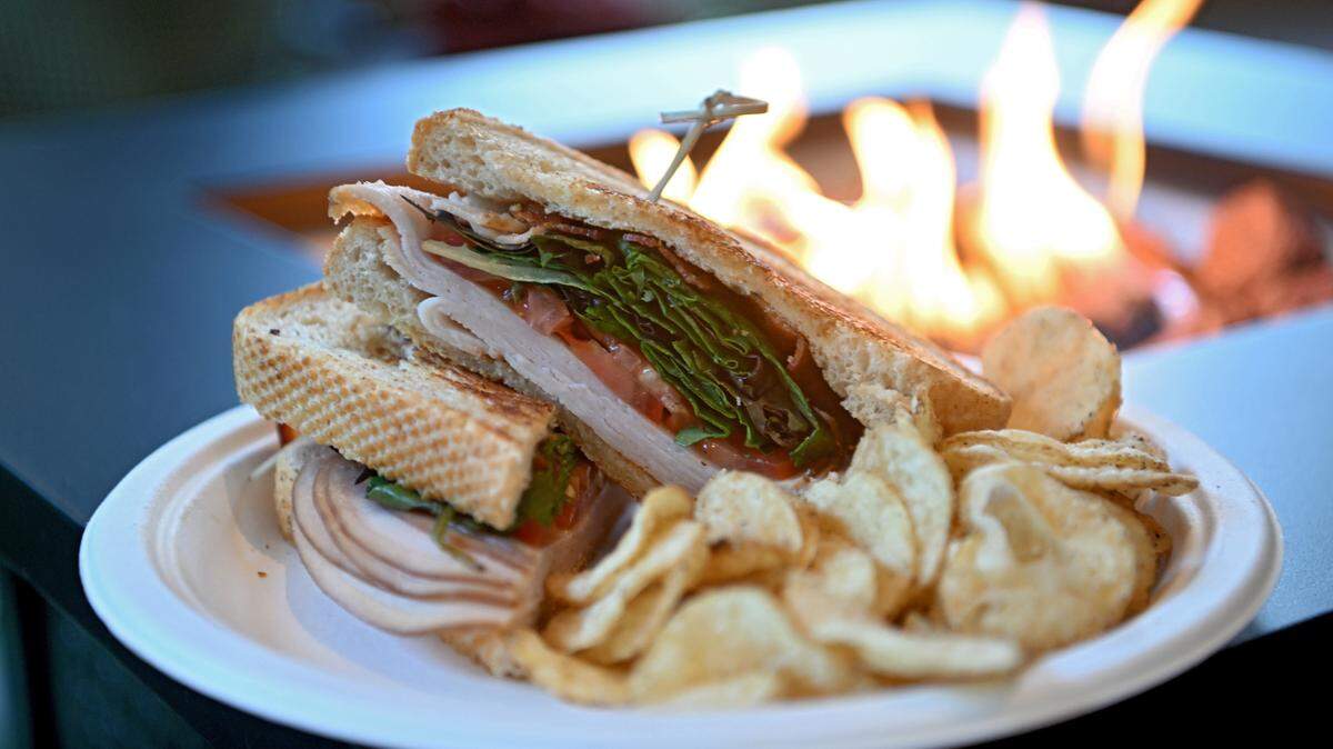 The “Turkey BLTA” sits by one of the new fire pits at Voodoo Brewery in State College on Tuesday, October. 24, 2023.