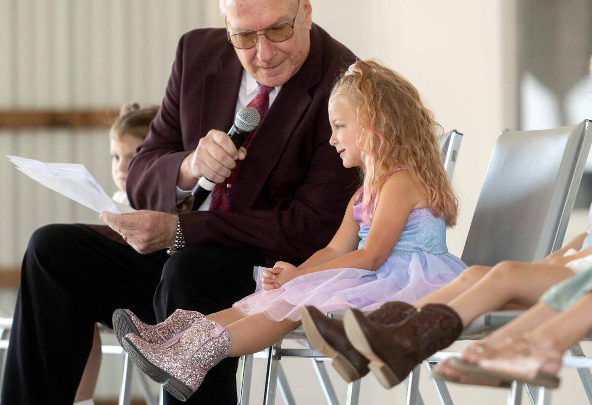 Emberlii Deibler, 3, answers questions during the Grange Fair Little King and Queen contest on Wednesday, Aug. 24, 2022.