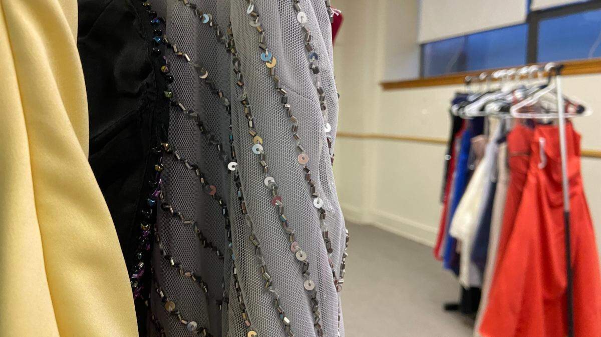 Racks and racks of dresses sit in the basement of the Fairmount Avenue Building.