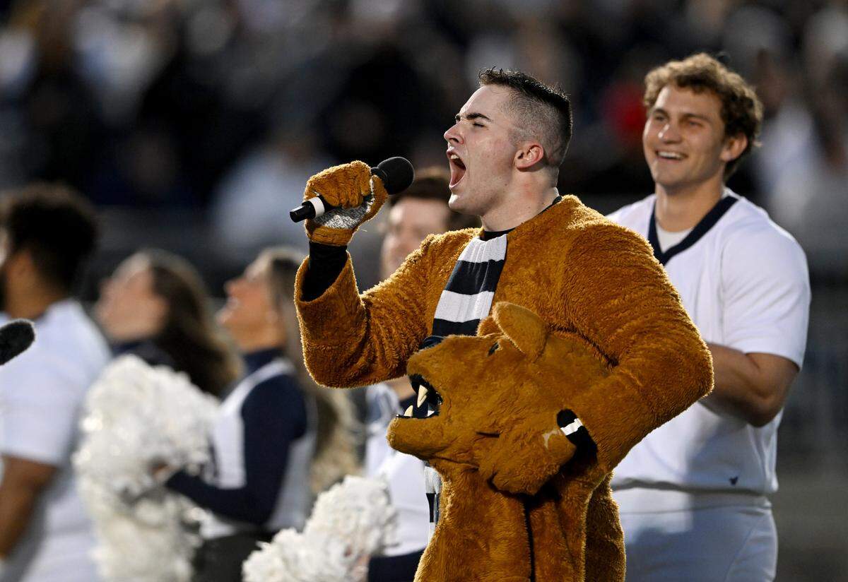 Penn State Nittany Lion mascot senior Michael McDermott leads a “we are” chant after being recognized during the game against Michigan State on Saturday, Nov. 26, 2022.