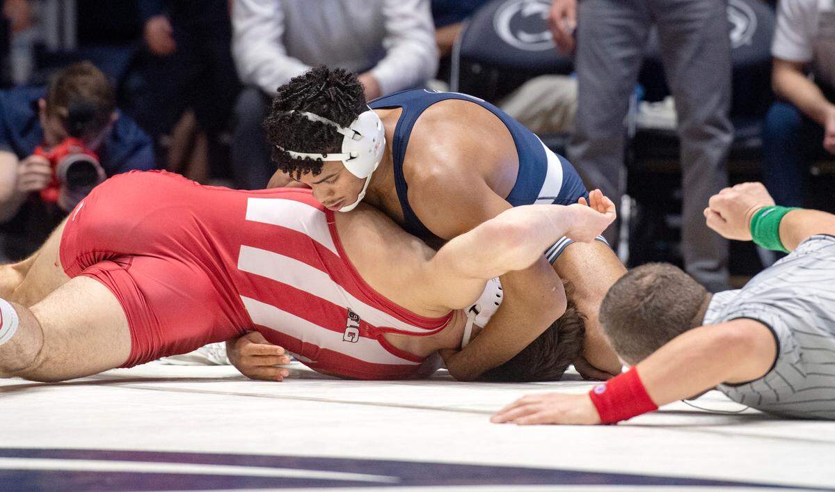 Penn State’s Carter Starocci rolls Indiana’s Sean Grim for a pin during the 174 lb bout during the match on Sunday, Jan. 9, 2022.