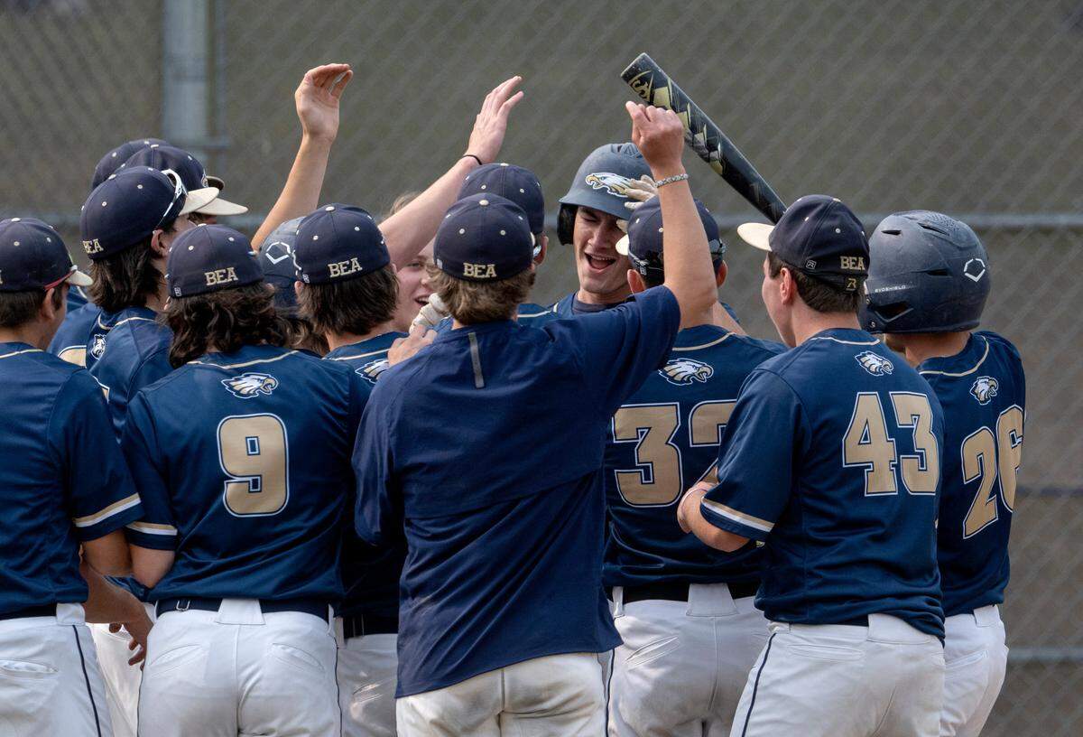 Bald Eagle Area’s Justin Bisel is congratulated by his teammates after his out of the park home run during the game against McConnnellsburg in the first round of the PIAA class 2A baseball playoffs on Monday, June 5, 2023.
