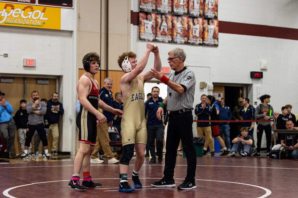 Bald Eagle Area’s Dawson Lomison celebrates his 5-2 win over Bishop McCort’s Jackson Butler in their 152-pound finals match of the District 6 Class 2A Championships on Saturday, Feb. 14, 2026, in Altoona.