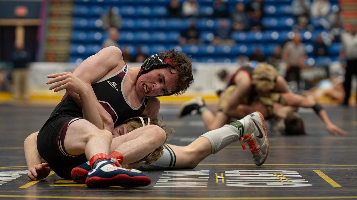 State High wrestler Noah Young pins his opponent at 114 pounds during the PIAA Class 3A dual championship wrestling quarterfinals in Johnstown, Pa., on Friday, Feb. 6, 2026. Franklin Regional beat State High 37-23.