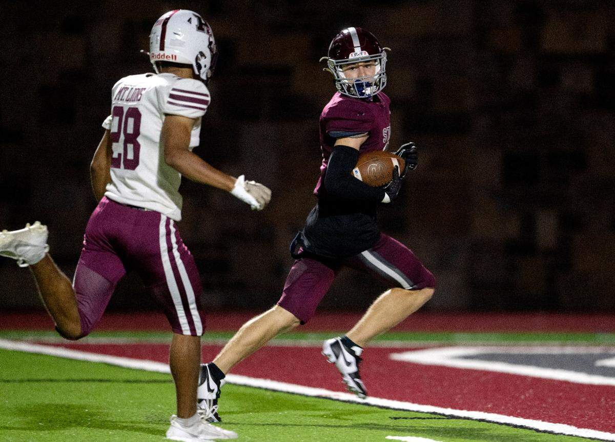 Altoona’s Branson Adams can’t stop State College’s Ty Salazar as he runs in for a touchdown during the third quarter of the game on Friday, Sept. 15, 2023.