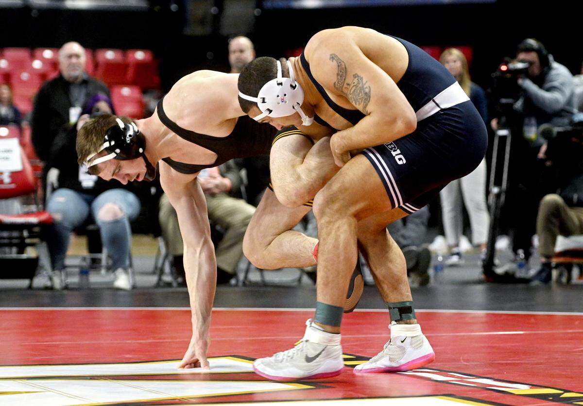 Penn State’s Aaron Brooks wrestles Iowa’s Zach Glazier in the 197 lb championship bout of the Big Ten Wrestling tournament at the Xfinity Center at the University of Maryland on Sunday, March 10, 2024.