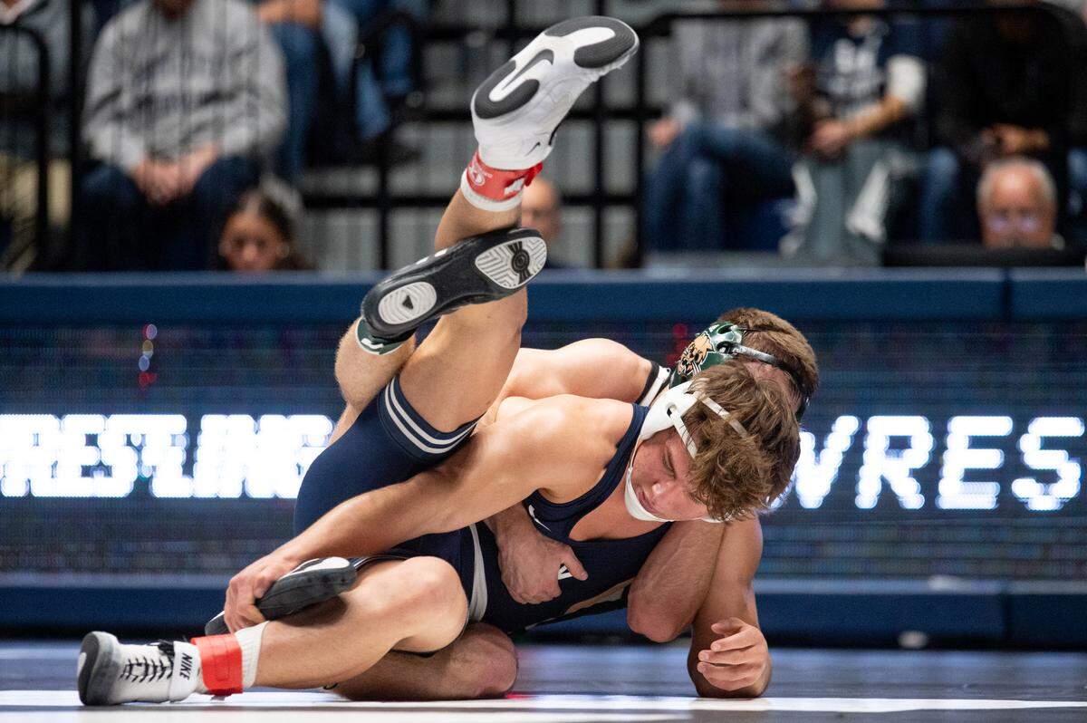 Tyler Kasak, front, wrestles Peyten Kellar, back, in a 157-pound bout during the NWCA All-Star Classic at Rec Hall on Saturday, Nov. 16, 2024. Kasak won the bout 4-2.