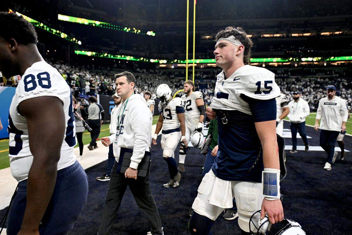 Penn State quarterback Drew Allar walks off the field in disappointment after falling to Oregon in the Big Ten Championship game at Lucas Oil Stadium on Saturday, Dec. 7, 2024.