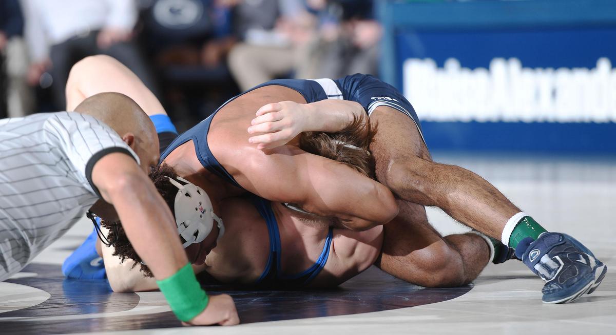 Penn State’s Mark Hall (right) pins Buffalo’s Jake Lanning Sunday at Recreational Hall. Penn State defeated Buffalo, 47-3.