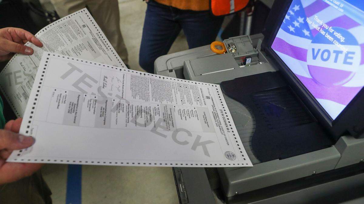 Test ballots were fed into voting machines ahead of Election Day 2022 in Chester County.