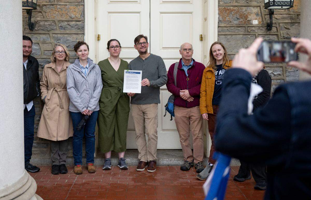 Members of the Penn State Faculty Alliance gathered at Old Main to delivered a petition to Penn State President Neeli Bendapudi’s office on Wednesday, May 21, 2025.