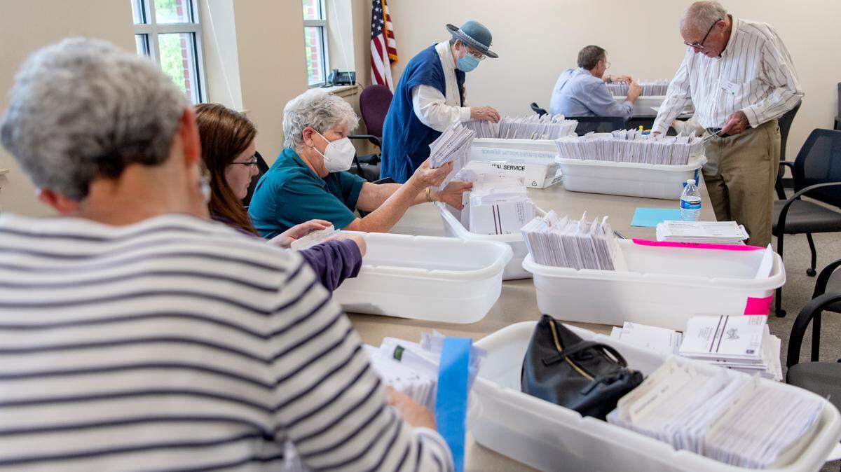 Volunteers and Centre County Elections employees organize mail-in ballots on May 16. A recount of the votes from the primary election is set to begin Wednesday.