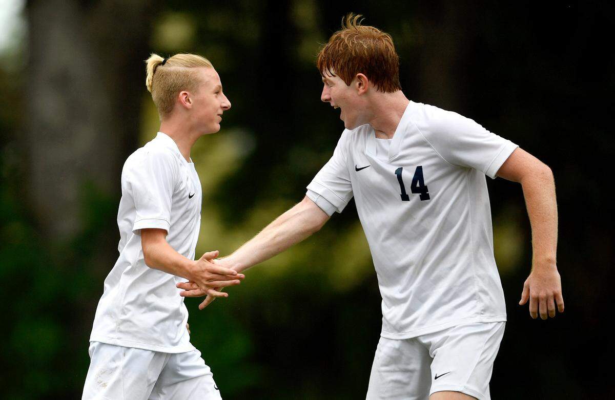 Philipsburg-Osceola’s Carson Long celebrates a goal with teammate Alex Godin during the game against Saint Joseph’s on Thursday, Sept. 16, 2021.