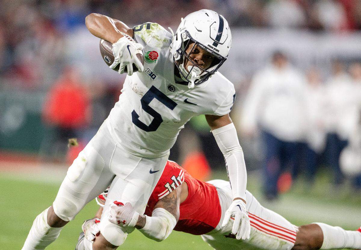 Utah’s JaTravis Broughton dives for Penn State wide receiver Mitch Tinsley during the Rose Bowl game on Monday, Jan. 2, 2023.