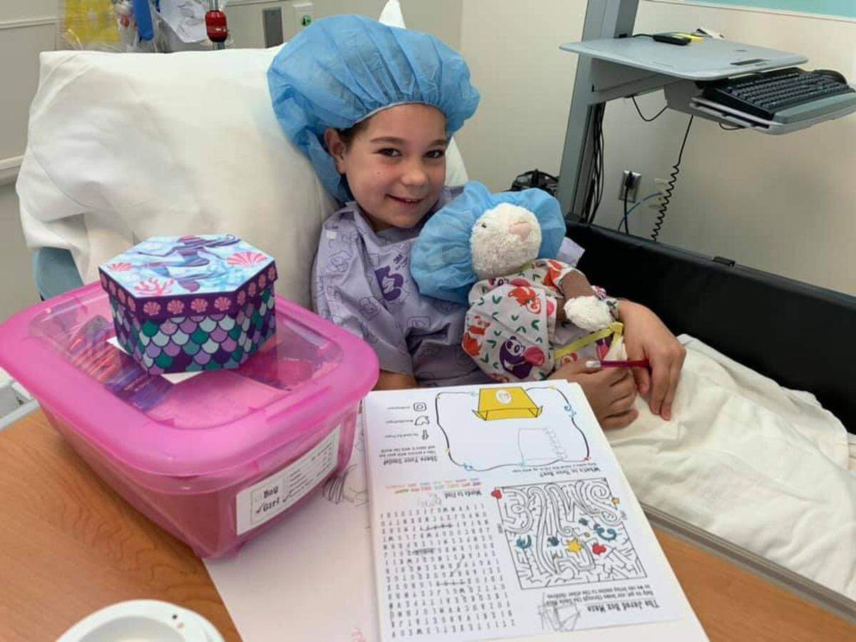 A child receives a Jared Box.