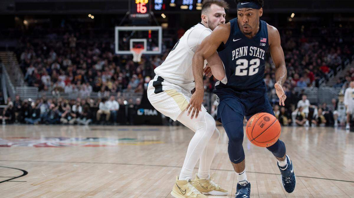 Penn State guard Jalen Pickett (22) dribbles past Purdue guard Sasha Stefanovic during the Big Ten Tournament at Gainbridge Fieldhouse on March 11 in Indianapolis. Penn State fell to Purdue 69-61 in the tournament quarterfinals.