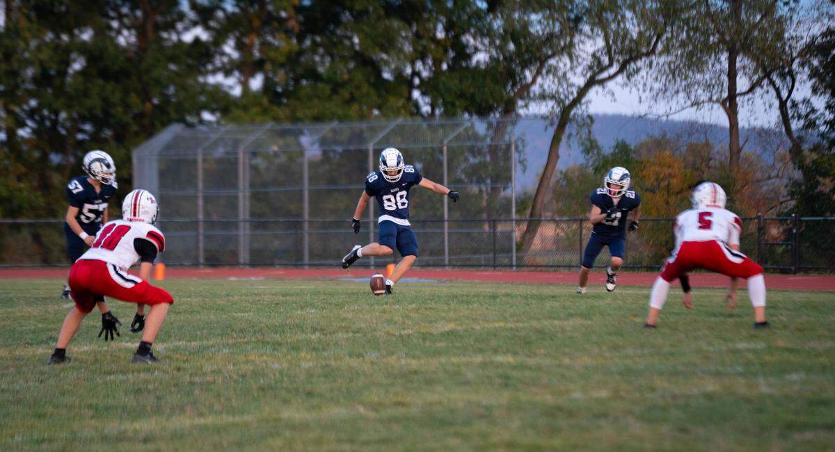Kicker Emery Reed (88) kicks the football to start a drive during a Friday night football game between Penns Valley Area and Bellefonte in Spring Mills, Pa., on Friday, Sept. 19, 2025. The Red Raiders beat the Rams 27-20.