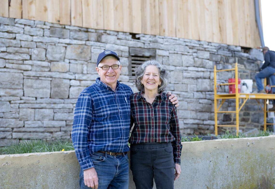 Gene and Rebecca Lengerich smile in front of their historic barn on Wednesday, April 22, 2026. The Lengerichs received a grant from the Historic Barn and Farm Foundation of Pennsylvania to help with repointing the foundation. 