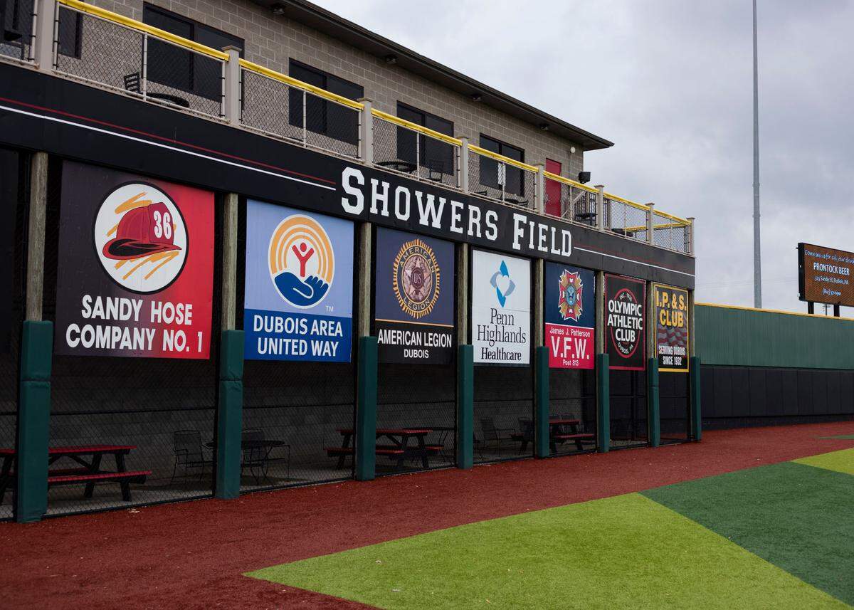 Signs on the fence at Showers Field.