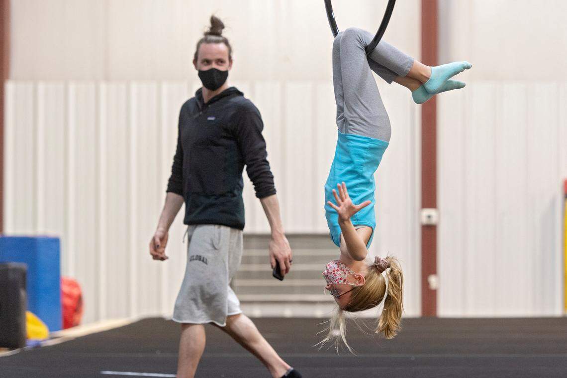 Brielle Long, 12, works on her lyra routine as Dmitry Myers coaches her at the Phoenix Academy of Performing Arts of Pennsylvania on Dec. 7.