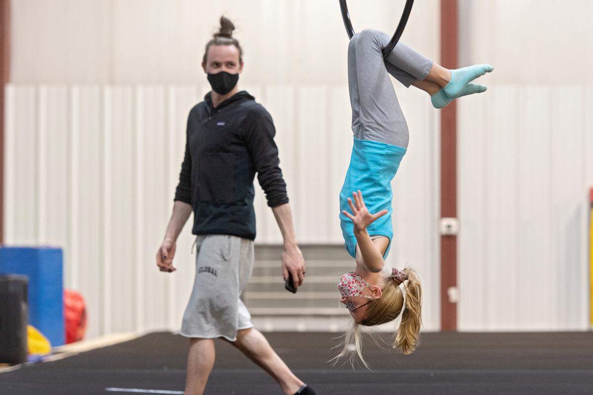 Brielle Long, 12, works on her lyra routine as Dmitry Myers coaches her at the Phoenix Academy of Performing Arts of Pennsylvania on Dec. 7.