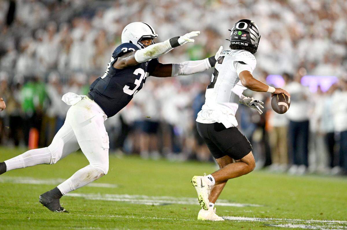 Penn state defensive end Dani Dennis-Sutton pressures Oregon quarterback Dante Moore during the game on Saturday, Sept. 27, 2025.
