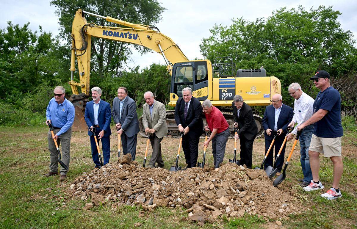 Edward Tubbs, chief executive officer of Hospitality Asset Management Company along with local business leaders break ground for the Tru Hotel by Hilton that will be built along Benner Pike on Tuesday, June 11, 2024.