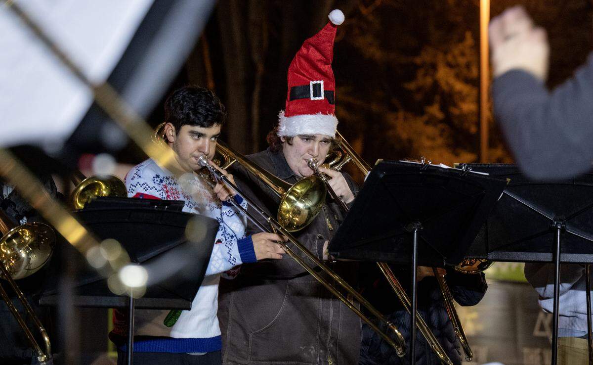 The Penn State Trombone Choir plays holiday music during Light Up Night on Thursday, Nov. 20, 2025.  