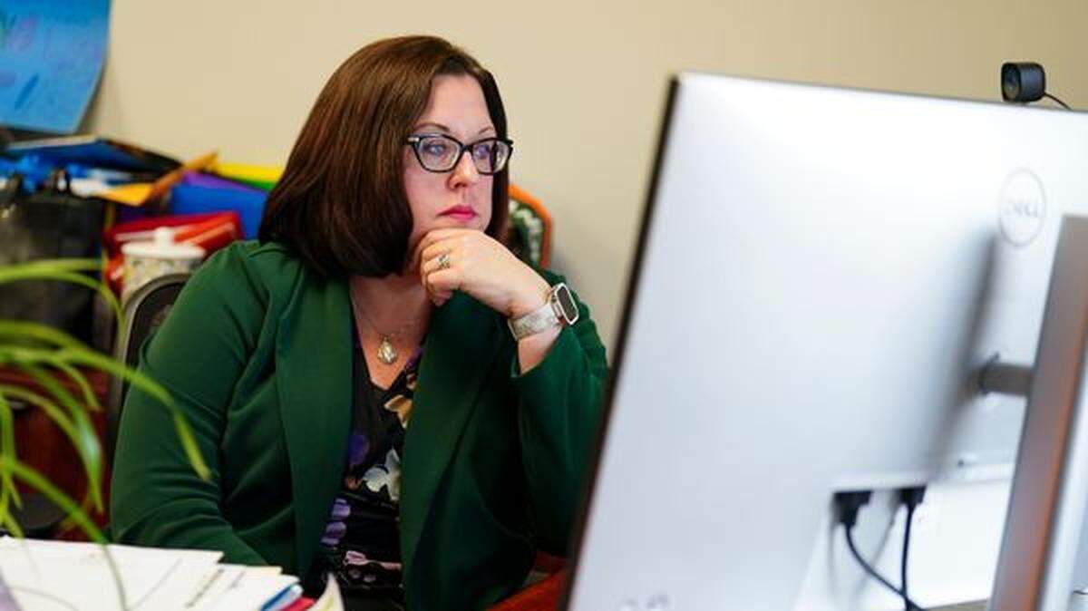 Scranton School District Superintendent Erin Keating looks at a computer on April 2, 2025, at the district’s administration building.