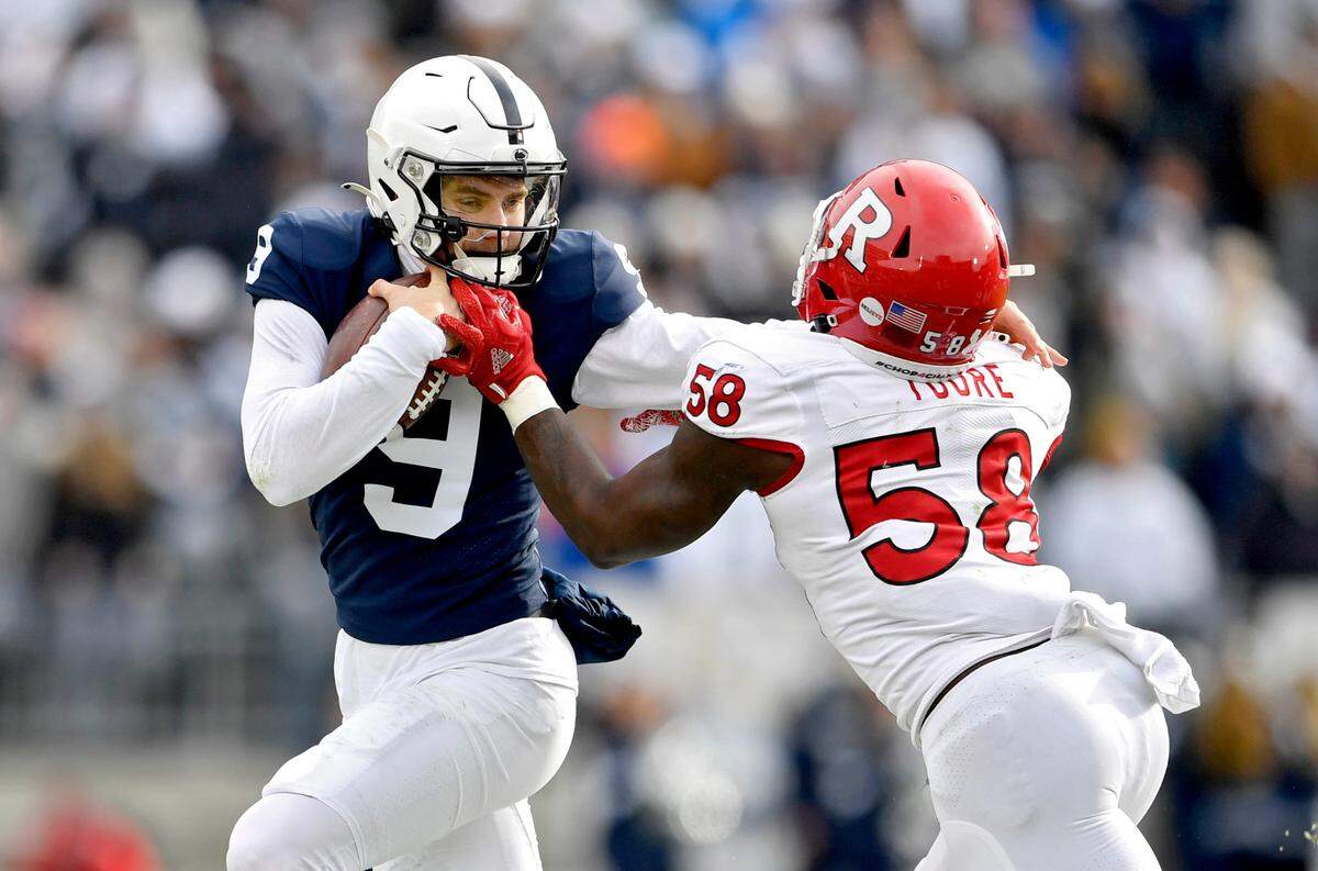 Penn State quarterback Christian Veilleux pushes around Rutgers linebacker Mohamed Toure during the game on Saturday, Nov. 20, 2021.