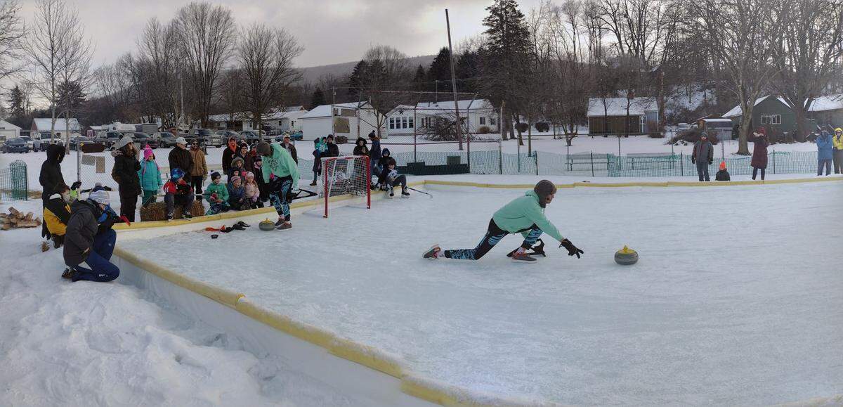 Nittany Valley Curling Club member Ben Hallman does an outdoor curling demo at Winter Fest on Feb. 5 at Blue Spring Park.