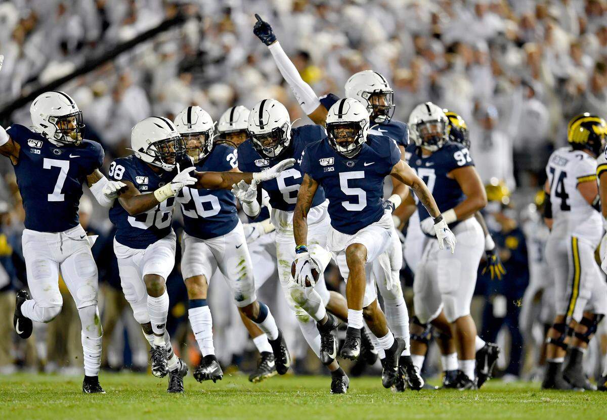 Penn State defense celebrates cornerback Tariq Castro-Fields’ interception during the game against Michigan on Saturday, Oct. 19, 2019.
