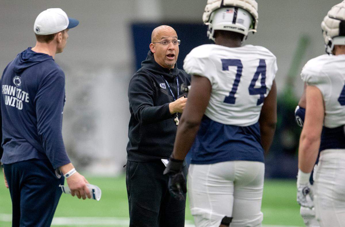Penn State football coach James Franklin talks to players during spring practice on Wednesday, April 20, 2022.