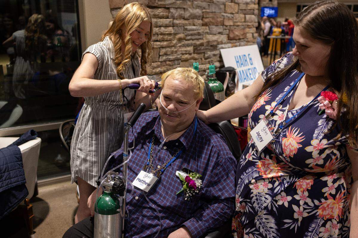 Guests get their hair done at Night to Shine on Friday, Feb. 7, 2025.