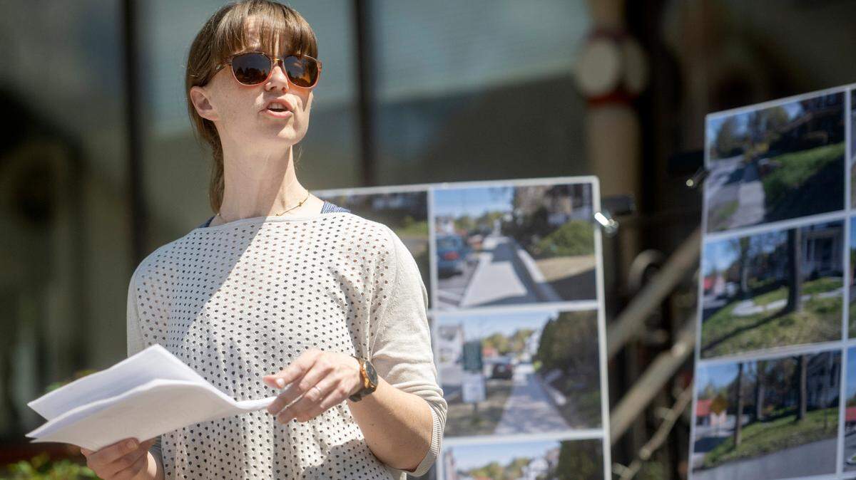 Carla Stilson, chair of the College Township Council, speaks during the Pike Street traffic calming and streetscape dedication in Lemont on Friday, April 21, 2023.