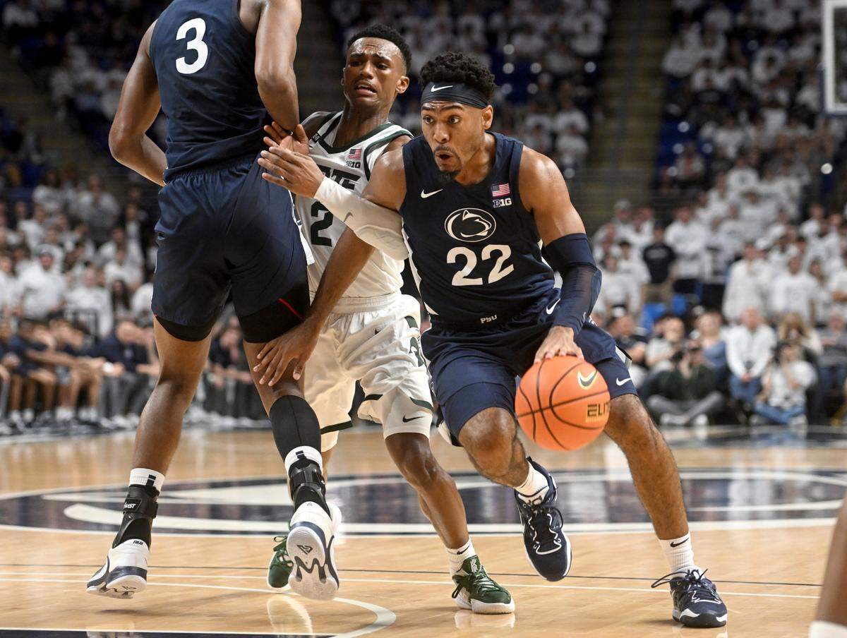 Penn State’s Jalen Pickett pushes around a Michigan State defender during the game on Wednesday, Dec. 7, 2022.
