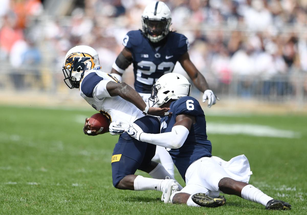 Penn State linebacker Cam Brown takes down Kent State wide receiver Antwan Dixon during a game Saturday, Sept. 15, 2018 at Beaver Stadium.